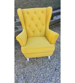 Żółty designerski fotel pikowany
