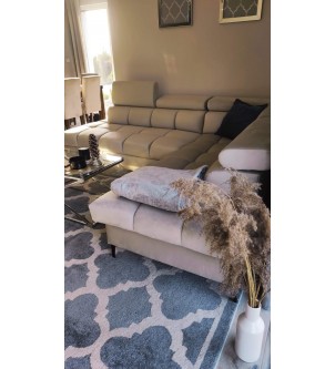 Biała sofa narożna z funkcją spania