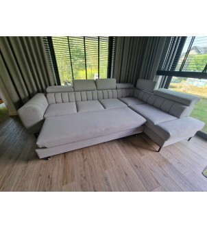 Sofa narożna z przeszyciem panelowym i funkcją spania