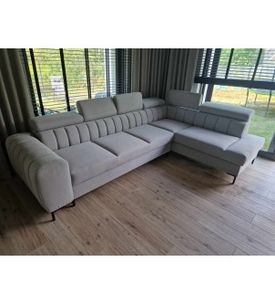 Sofa narożna z przeszyciem panelowym i funkcją spania